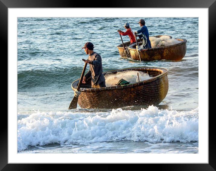 Fishermen returning in their coracles Framed Mounted Print by Kevin Hellon