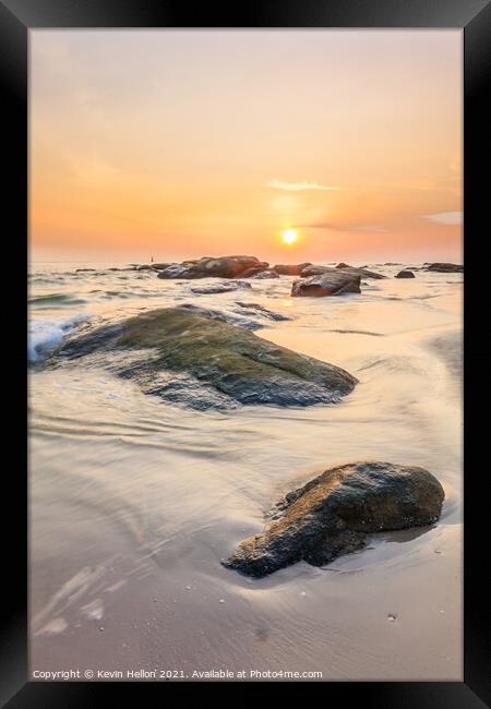 Sunrise over the rocks Framed Print by Kevin Hellon