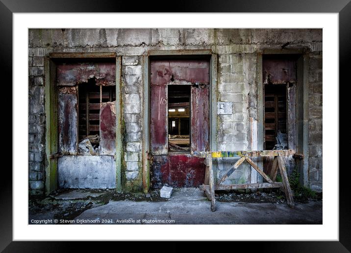 The three red doors in an abandoned factory Framed Mounted Print by Steven Dijkshoorn