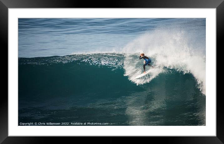 surfer is surfing on the high waves of the ocean Framed Mounted Print by Chris Willemsen