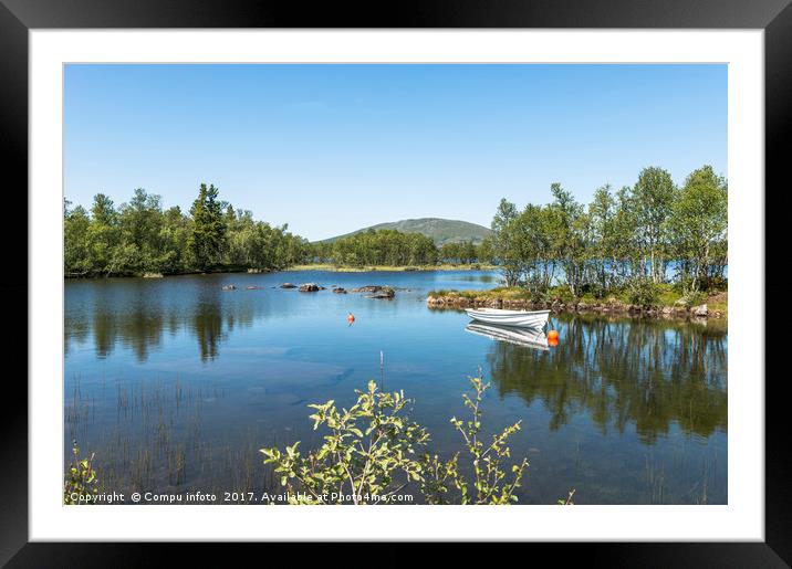 small motorboat in fjord Framed Mounted Print by Chris Willemsen