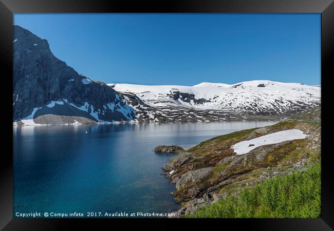 fjord with snow in summer in norway Framed Print by Chris Willemsen