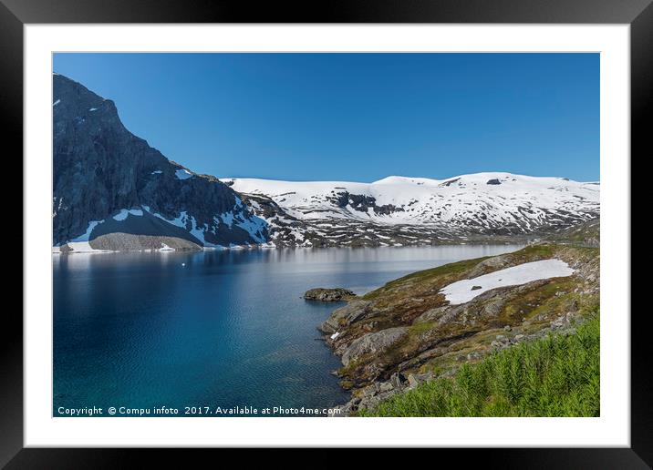 fjord with snow in summer in norway Framed Mounted Print by Chris Willemsen