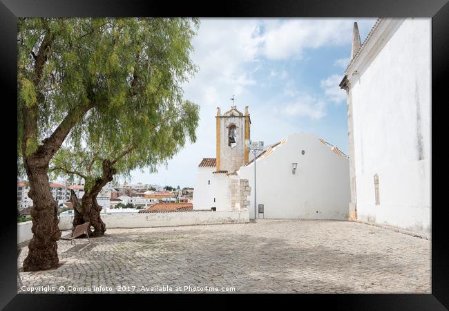 olive trees and church in tavira Framed Print by Chris Willemsen