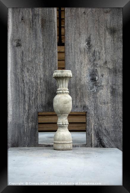 concrete vase and wooden background Framed Print by Chris Willemsen