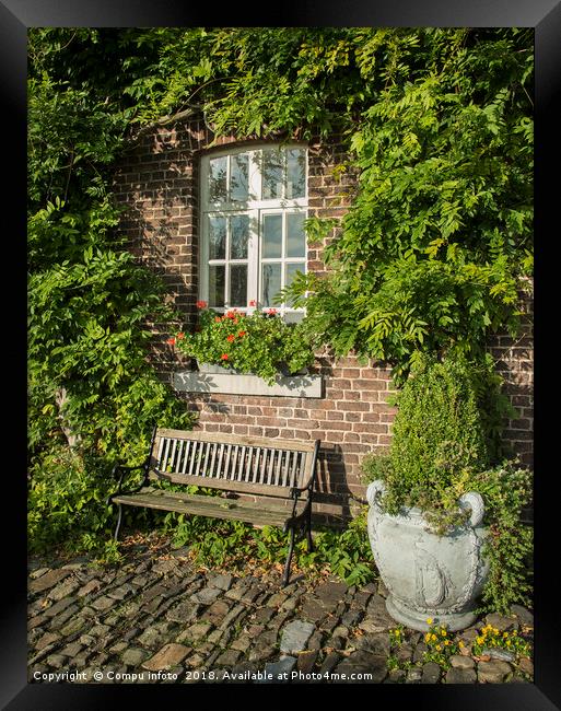 old farm with green plants on the wall Framed Print by Chris Willemsen