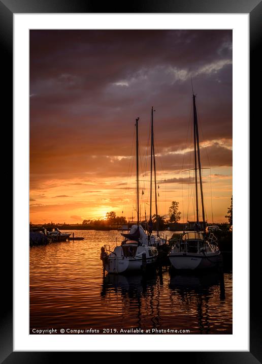 sunset in the harbor of de veenhoop in holland Framed Mounted Print by Chris Willemsen