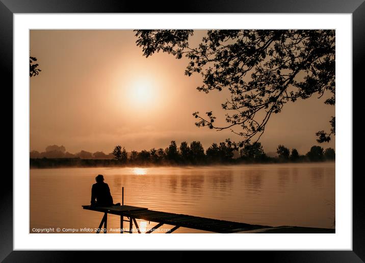 silhouette girl at wooden jetty sunrise over the river maas in Holland Framed Mounted Print by Chris Willemsen