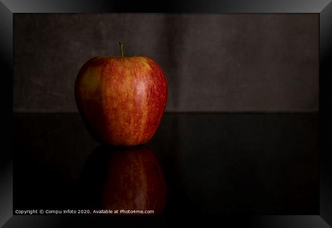 One red apple isolated on black Framed Print by Chris Willemsen