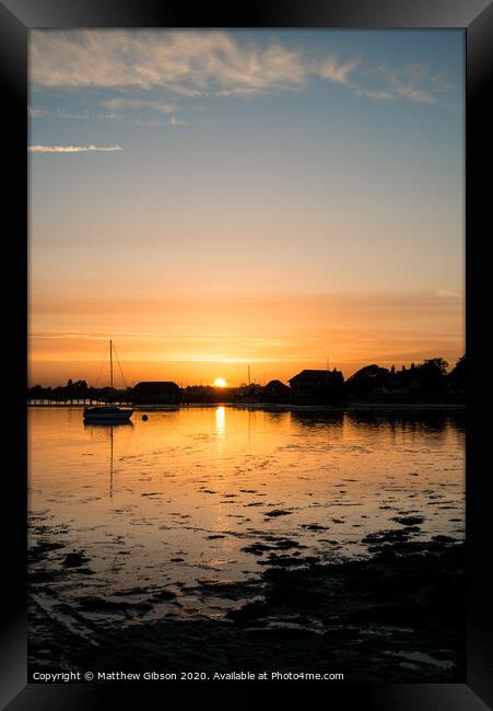 Beautiful Summer sunset landscape over low tide harbor with moored boats Framed Print by Matthew Gibson