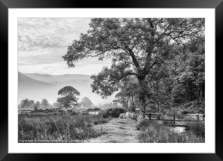 Beautiful foggy misty black and white landscape Autumn sunrise over countryside surrounding Crummock Water in Lake District in England Framed Mounted Print by Matthew Gibson