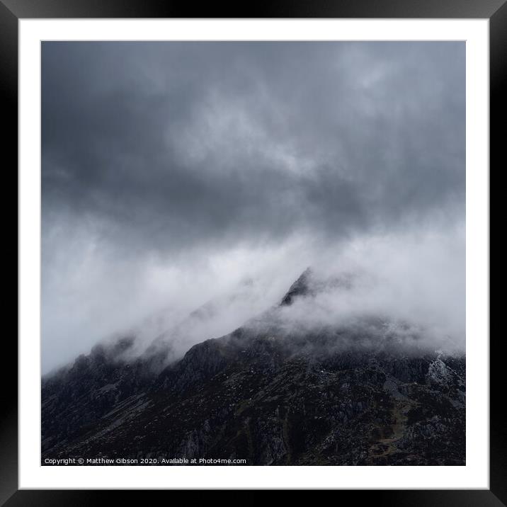 Stunning detail landscape images of snowcapped Pen Yr Ole Wen mountain in Snowdonia during dramatic moody Winter storm Framed Mounted Print by Matthew Gibson