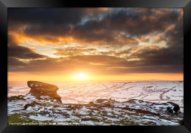 Stunning Winter sunset over snow covered Winter landscape in Peak District Framed Print by Matthew Gibson