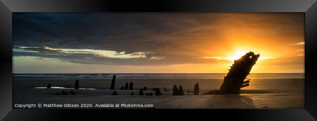 Landscape panorama ship wreck on Rhosilli Bay beach in Wales at sunset Framed Print by Matthew Gibson