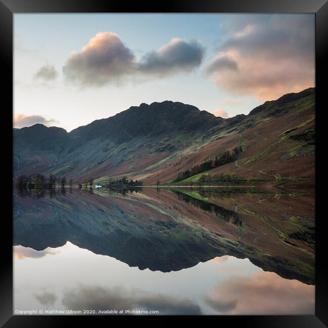 Majestic vibrant Autumn Fall landscape Buttermere in Lake District with beautiful early morning sunlight playing across the hills and mountains Framed Print by Matthew Gibson