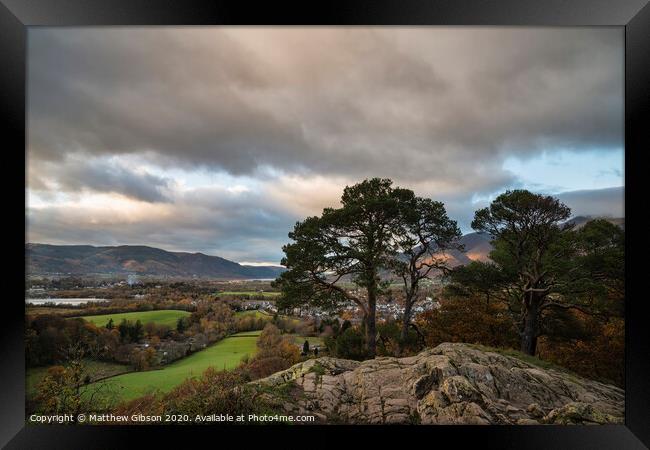 Majestic Autumn Fall landscape image of view from Castlehead in Lake District towards Skiddaw at sunset with beautiful lighting in sky Framed Print by Matthew Gibson