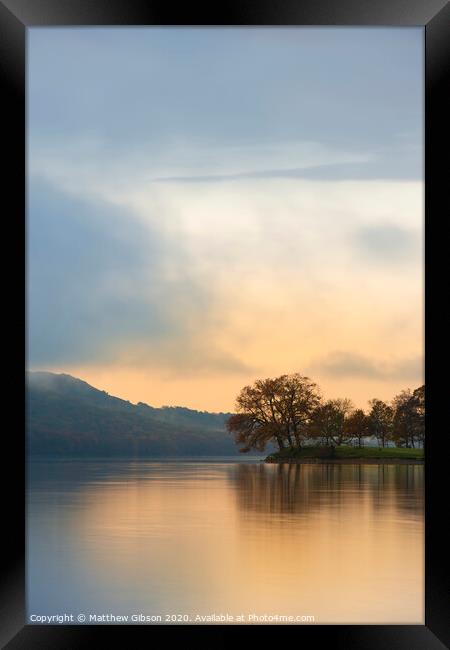 Stuning Autumn Fall sunrise landscape over Coniston Water with mist and wispy clouds Framed Print by Matthew Gibson