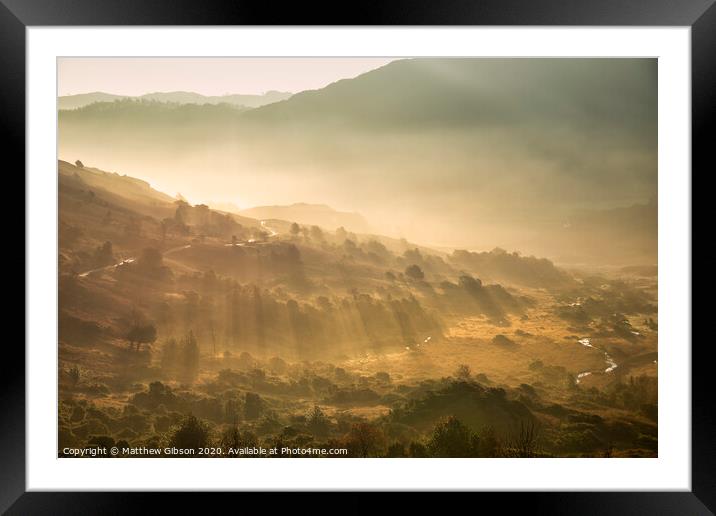 Beautiful Autumn Fall landscape sunrise in the Lake District with sun rays streaming through the fog into The Langdales valley Framed Mounted Print by Matthew Gibson