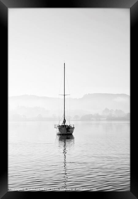 Stunning unplugged fine art landscape image of sailing yacht sitting still in calm lake water in Lake District during peaceful misty Autumn Fall sunrise Framed Print by Matthew Gibson