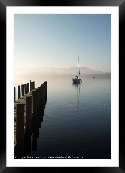 Stunning unplugged fine art landscape image of sailing yacht sitting still in calm lake water in Lake District during peaceful misty Autumn Fall sunrise Framed Mounted Print by Matthew Gibson