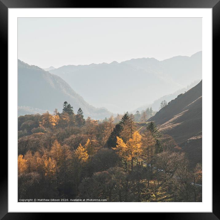 Beautiful Autumn Fall landscape image of the view from Catbells in the Lake District with vibrant Fall colors being hit by the late afternoon sun Framed Mounted Print by Matthew Gibson