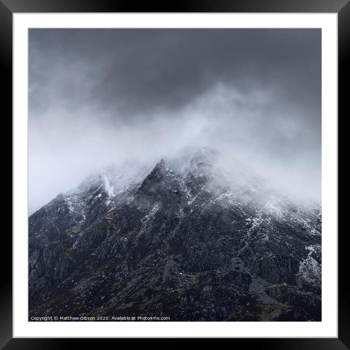 Stunning detail landscape images of snowcapped Pen Yr Ole Wen mountain in Snowdonia during dramatic moody Winter storm Framed Mounted Print by Matthew Gibson