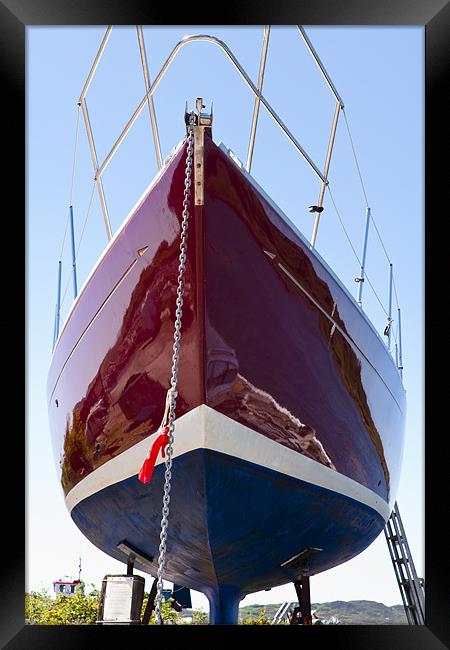 Reflections in a polished yacht hull Framed Print by Hugh McKean