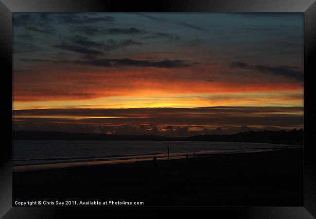 Sunset over Poole Bay Framed Print by Chris Day