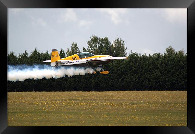 Extra 300 aerobatic plane taking off Framed Print by Chris Day