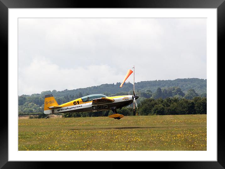 Extra 300 aerobatic plane lnding Framed Mounted Print by Chris Day