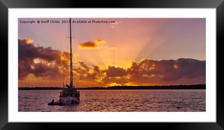 Sunrise rays boat and sea. Framed Mounted Print by Geoff Childs