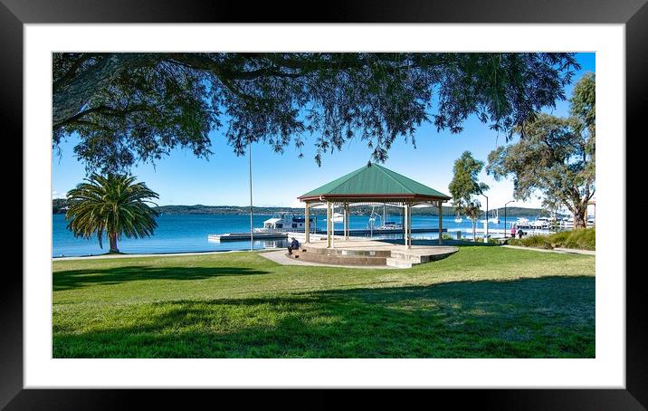  Lush green grassy waterfront park with a quaint l Framed Mounted Print by Geoff Childs