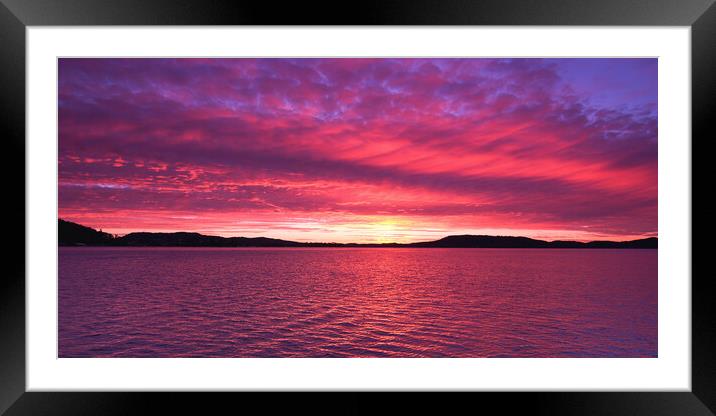 Magenta coloured  Sunrise Seascape Panorama. Framed Mounted Print by Geoff Childs