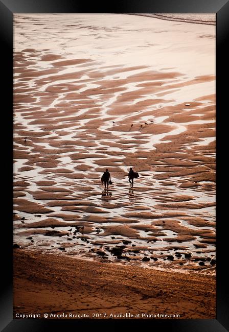 Surfers with bodyboards on sunset Framed Print by Angela Bragato