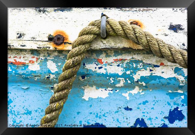 Rope on old boat Framed Print by Angela Bragato