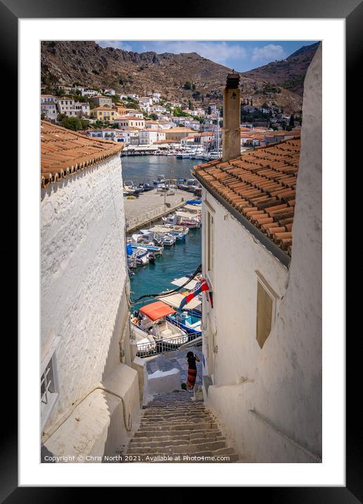 Rooftops and marina of Hydra. Framed Mounted Print by Chris North