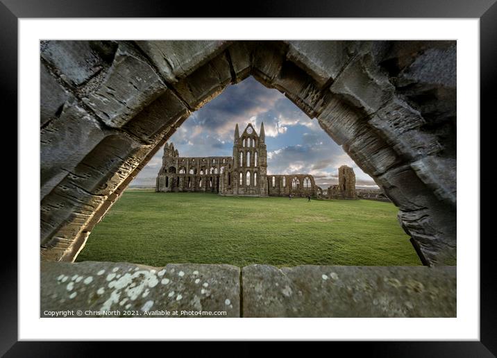 Saint Hildas Abbey Whitby seen through a ruined Gothic arch. Framed Mounted Print by Chris North