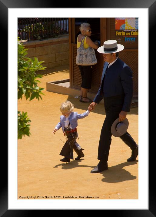 A person holding a child Framed Mounted Print by Chris North