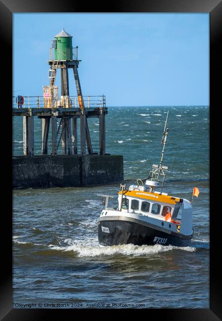 Nearly Home. A local fishing boat returns to safe  Framed Print by Chris North