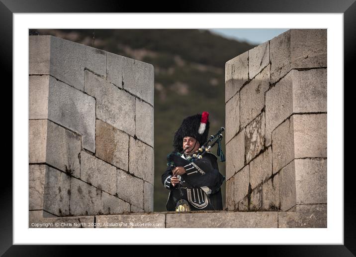 Highland Piper on the battlements of the fortress  Framed Mounted Print by Chris North