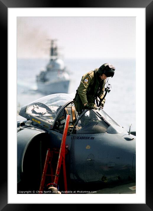 Pilot climbing onboard a Sea Harrier. Framed Mounted Print by Chris North