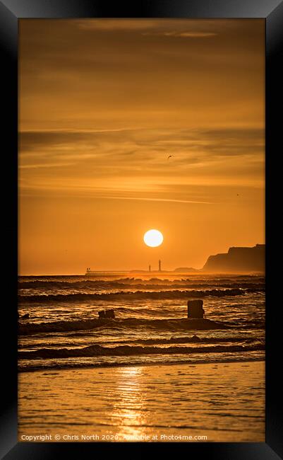 Sunrise over Whitby viewed from Sandsend. Framed Print by Chris North