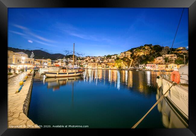 Symi Harbour at night. Framed Print by Chris North