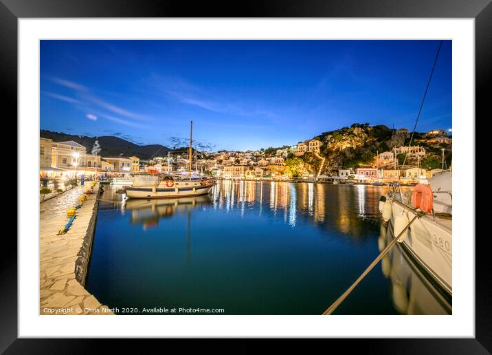 Symi Harbour at night. Framed Mounted Print by Chris North
