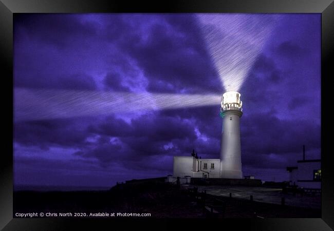 Flamborough Lighthouse, a dark and stormy night. Framed Print by Chris North