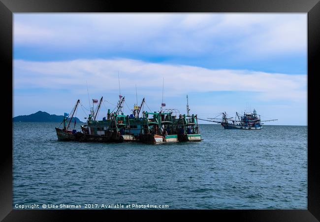 Fishing boats at sea in Thailand Framed Print by  