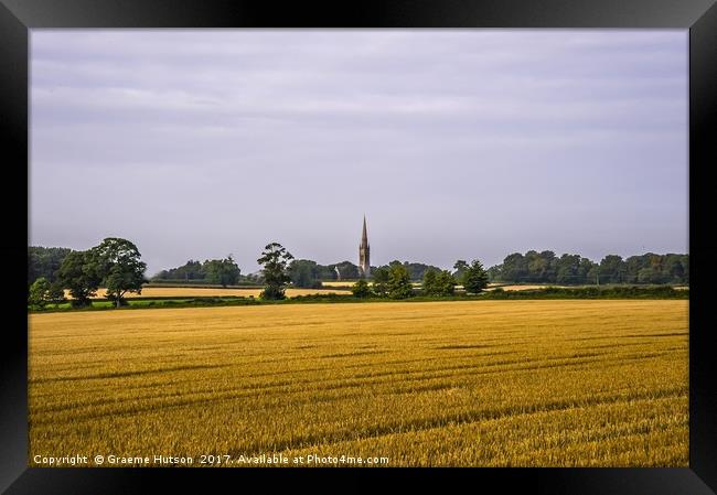 Cornfield and church at harvest time Framed Print by Graeme Hutson