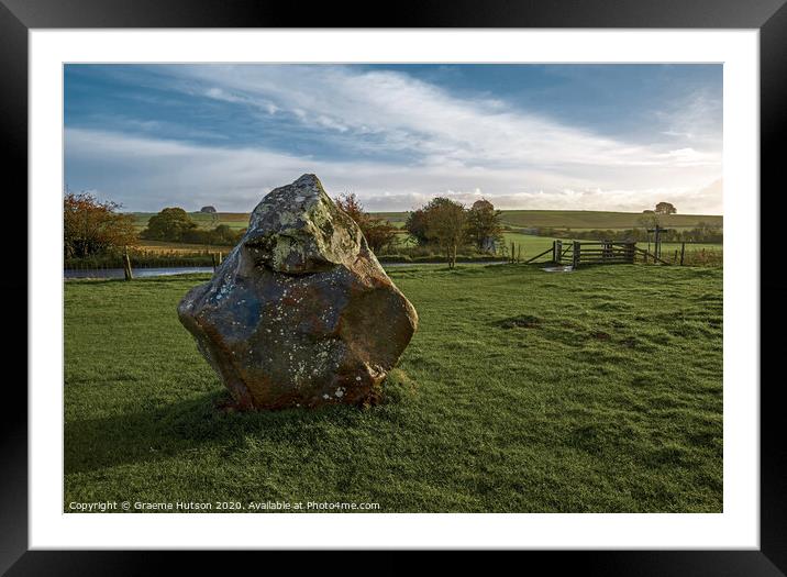 An ancient standing stone Framed Mounted Print by Graeme Hutson
