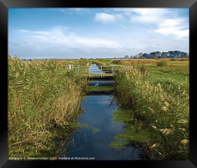 Footbridge over a stream Framed Print by Graeme Hutson