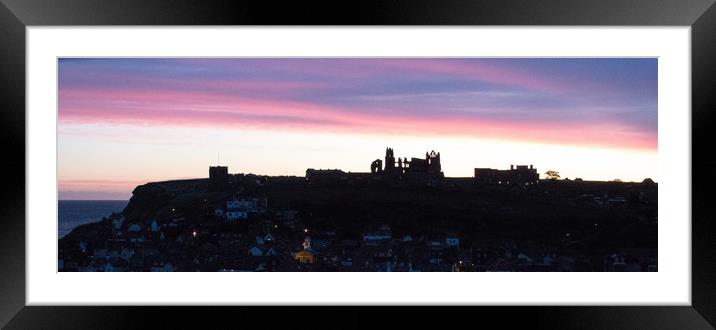Sunrise behind Whitby famous for Dracula Stories Framed Mounted Print by Janet Mann